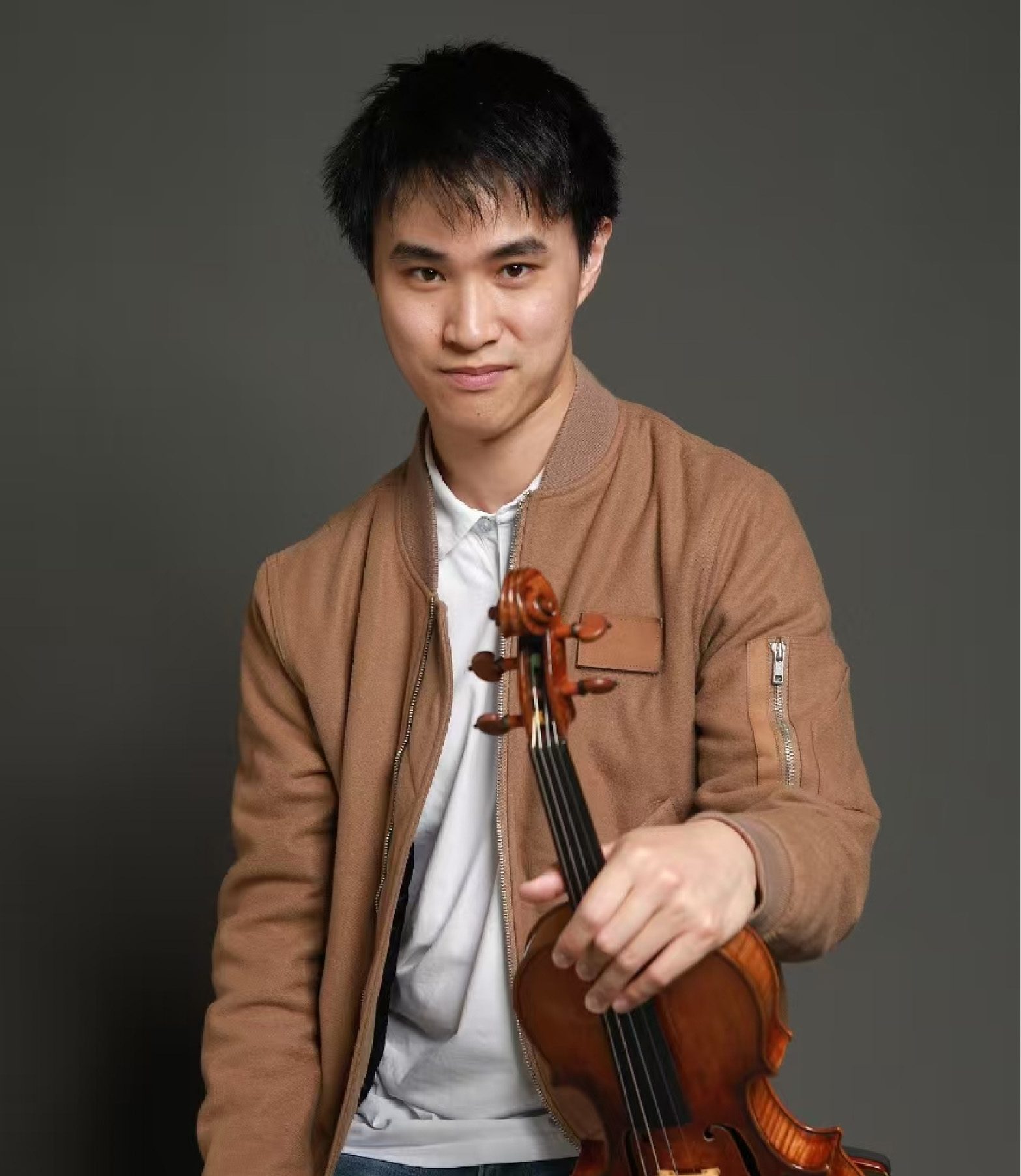 Violinist Kevin Zhu has rapidly established himself as one of the leading young artists of his generation. Winner of the First Prize at the 2018 Paganini International Violin Competition and the 2012 Yehudi Menuhin International Violin Competition for Young Violinists, Zhu is acclaimed for his technical mastery, expressive depth, and commanding stage presence.